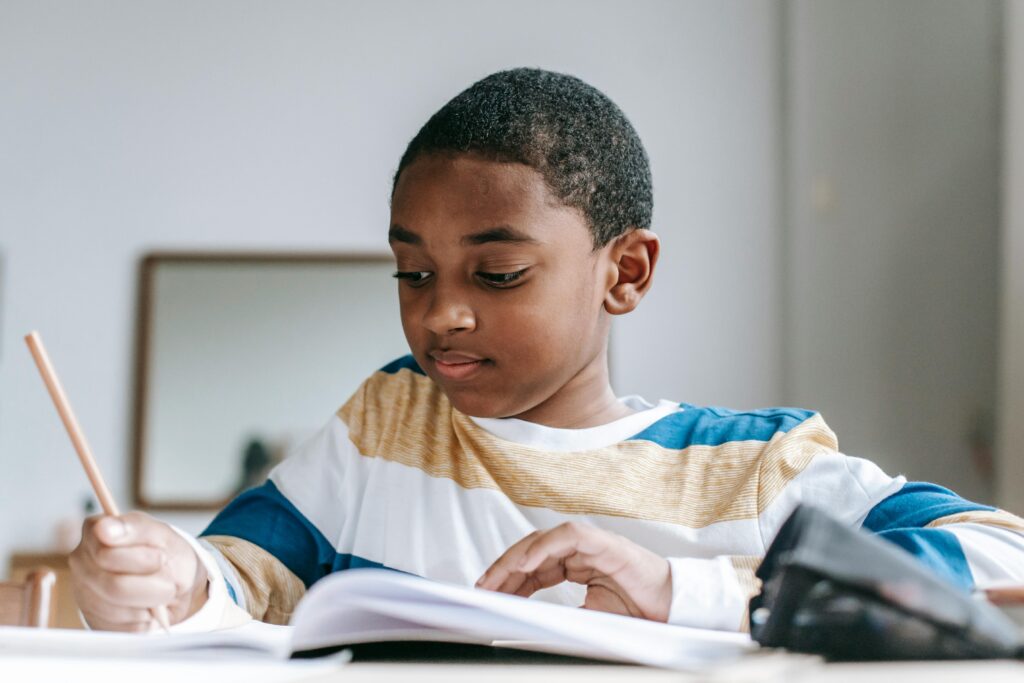 student writing in a book